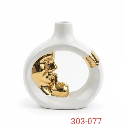 White and gold shh face sculpture