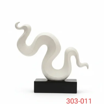 White ceremic snake shaped sculpture