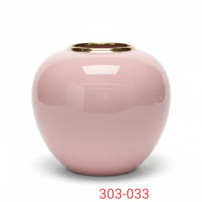 Pink ceremic vase with gold opening